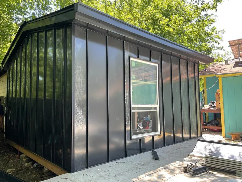 Black standing seam metal wall panels for Metal Roof Installation in Antis